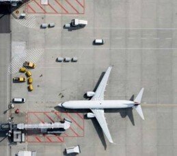 Aerial view of an aircraft being serviced on the tarmac