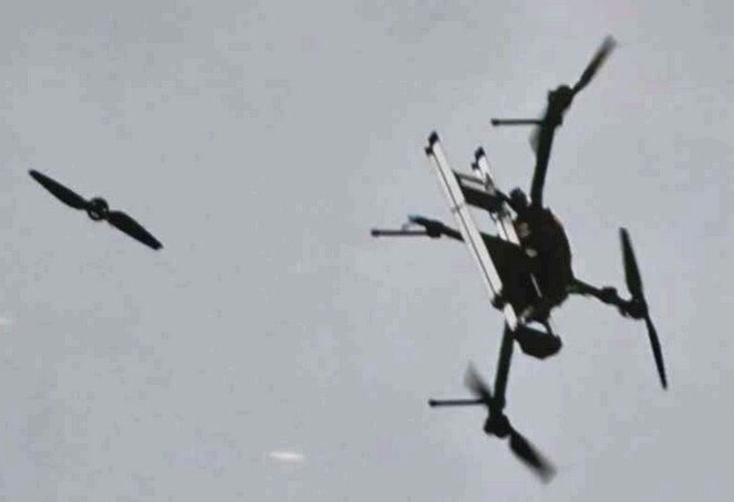 MegaQuad mid-air with a propeller and motor separated from the frame during the crash